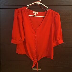 Red short sleeve top with tie. Riley and Ray extra small.